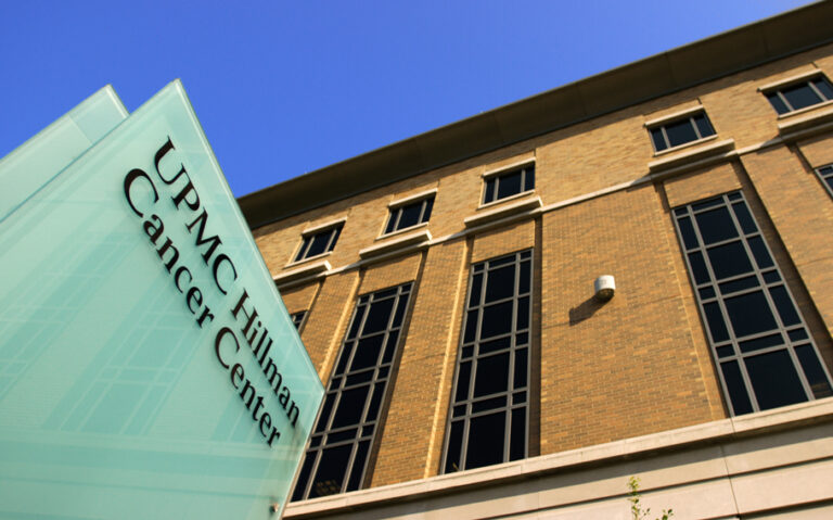 Upshot image of the UPMC Hillman. Cancer Center, a blue clear sky in the background